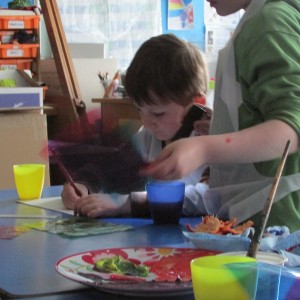 Children exploring colour in painting at Children's Art School holiday course led by artist, Karen Logan