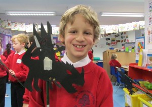 child with his puppet at childrens art club