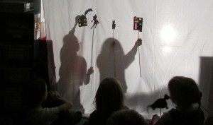 Children's shadow puppet show at after school art club