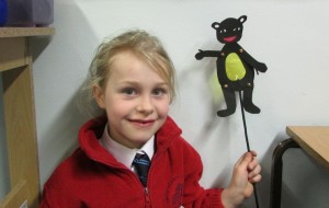 Girl and shadow puppet at after school art club
