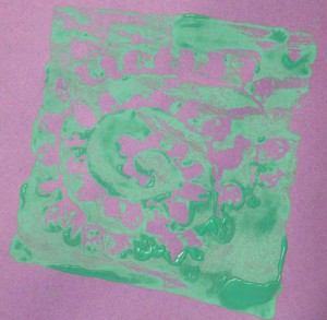Block print on coloured paper at children's after school art club