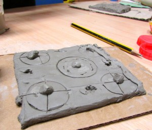 A relief pattern tile made at the children's art school after school club