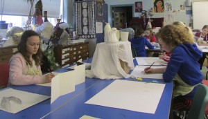 Making still life sketches in the children's art school half term 3D drawing course with artist, Chrys Allan