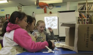 Creating a cardboard box room at children's art school holiday course with artist Chrys Allan