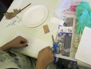 Creating textured backgrounds for printmaking at the children's art school holiday printmaking course with artist, Chrys Allen