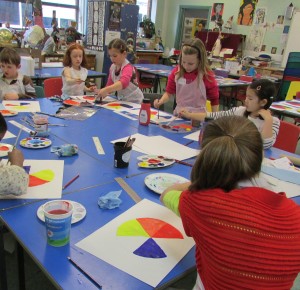 Painting colour wheels at Children's Art School half term painting course led by artist, Karen Logan