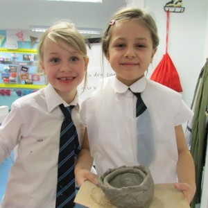 Proud potters at the chlldren's art school after school club led by artist Karen Logan